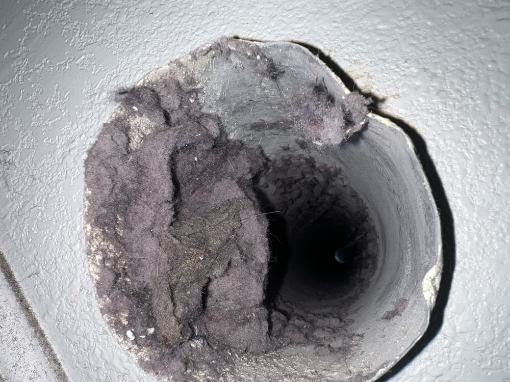Flexible dryer vent tube with heavy lint buildup in Oakland, CA Flexible dryer vent tube with heavy lint buildup in Oakland, CA